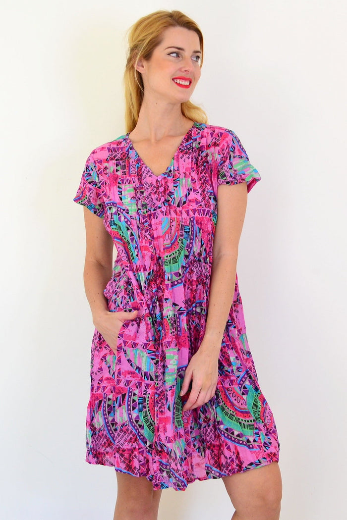 Pink tropical Nicola dress tunic by One Summer with cap sleeves, featuring a vibrant tropical print and relaxed fit.