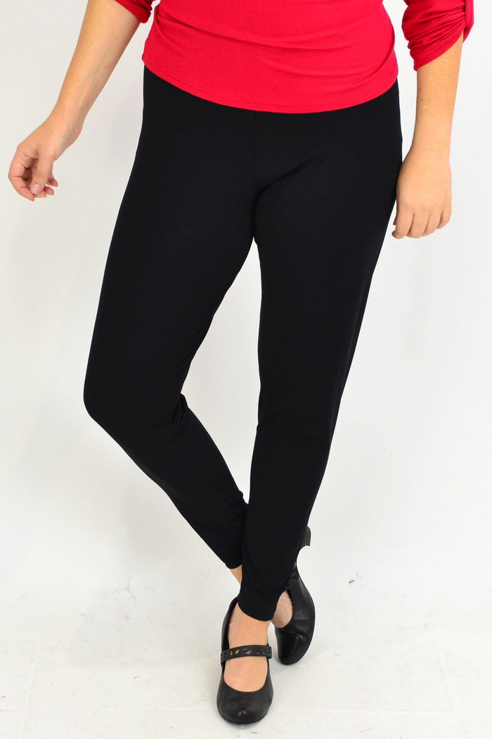 Plus size long black leggings by Room to Move, made in Australia, shown on a model with a comfortable fit and stretchy fabric.
