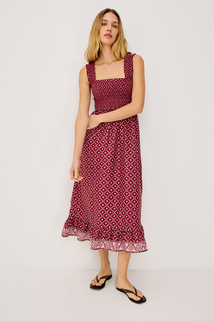 Rumi Midi Dress in Cotton Voile With Smocked Shoulder Straps and Bust, Empire Waist, and Ruffle Hem in Flower Chain Colorway - Full Body Front View Featured on Model