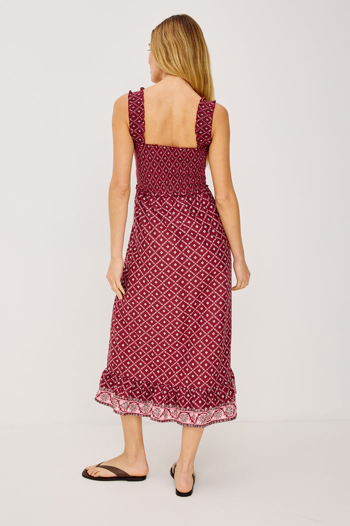 Rumi Midi Dress in Cotton Voile With Smocked Shoulder Straps and Bust, Empire Waist, and Ruffle Hem in Flower Chain Colorway - Full Body Back View Featured on Model