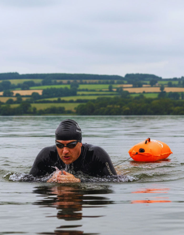 Simply Swim black silicone swim cap with white logo and 28L dry bag buoy