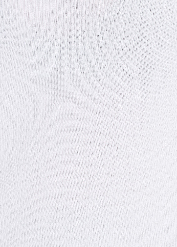 Close-up of soft white ribbed knit fabric texture showing fine vertical detailing