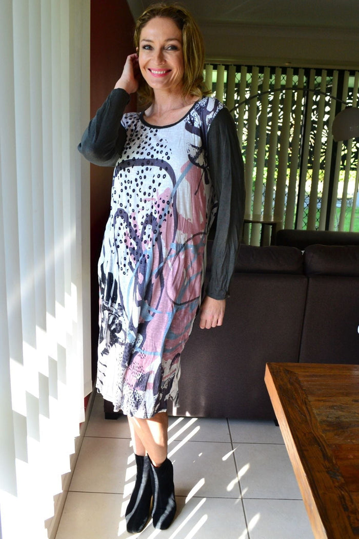 Cafe Latte Sweet Caroline Crinkle Tunic Dress hanging on a hanger with a ruffled neckline and crinkled fabric, showcasing a casual, flowy style.