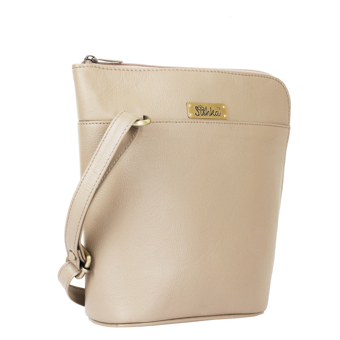 Women's taupe leather crossbody shoulder sling bag for work, travel, and daily use-half side view