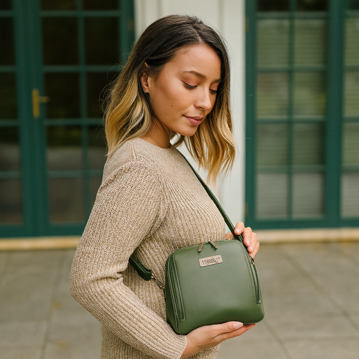 Women's olive green leather crossbody sling bag for work, travel, and daily use-model image