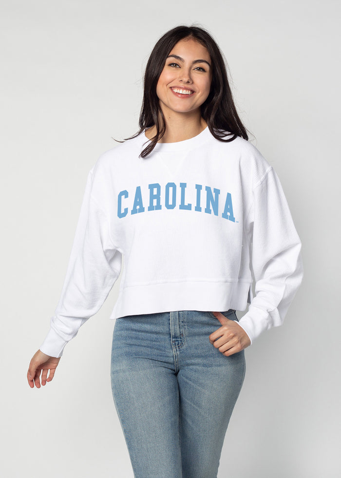 North Carolina Tar Heels Women's White Relaxed Premium cotton corded fleece Sweatshirt with Super soft hand feel, vintage wash, side slits and ribbed crew neckline, cuffs, and hemline