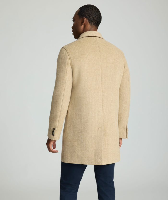 Model is wearing UNTUCKit Wool Top Coat.