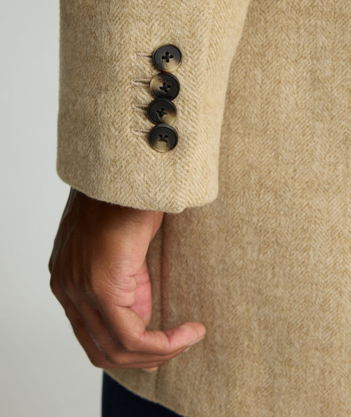 Model is wearing UNTUCKit Wool Top Coat.